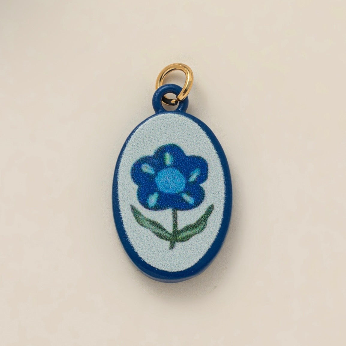 Painted blue flower charm