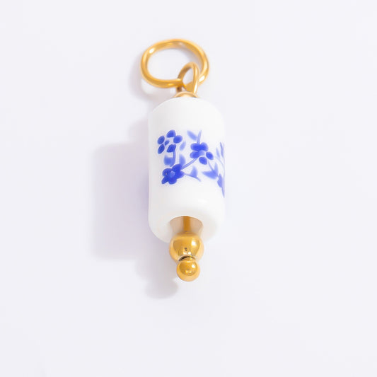 Painted blue circular charm